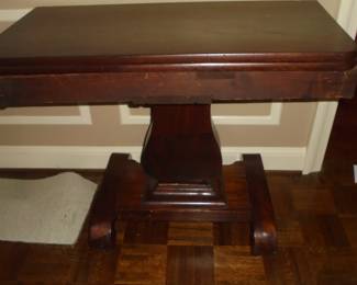 Mahogany lire base table w/castors 36"W x 18" D x 29"T.