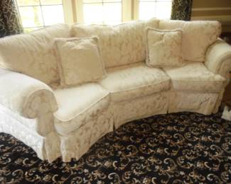 White concave couch w/brocade flower pattern 10' x 3 1/2' w/matching pillows