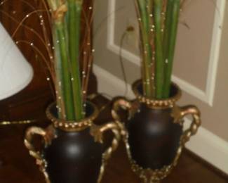Pair black & gold matching urns w/flowers
