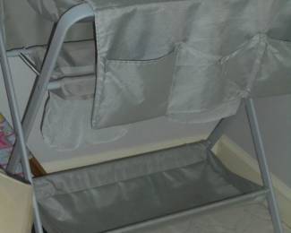Gray metal changing bed