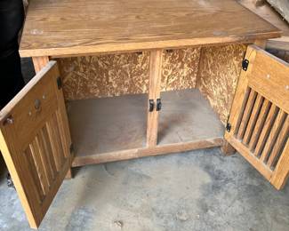 Wooden dog crate end table opened. 