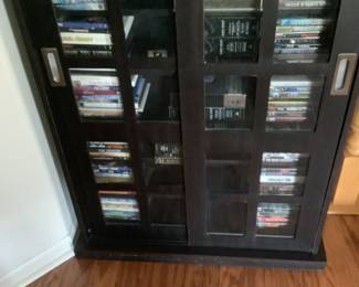 Storage Cabinet for DVDs and CDs. Cabinet is avaialable for presale $75.