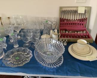 Full set of community stainless flatware, cut glass and glassware