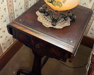 One of two antique matching accent tables