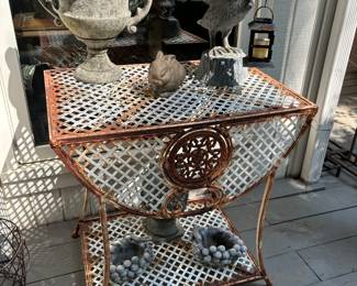 Nice Iron table, concrete urn, pelican lantern, rabbit