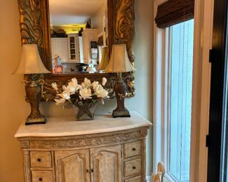 Country French Cream color stone top, detailed applicaque, turned legs, 2 doors 6 drawers.  47"wX22"X36"T