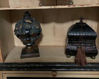 Primitive clock on easel, burnished black and gold compote and leather like box with bun feet