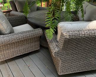 Member's Mark 5 Piece Fire Pit Chat Set.  Chairs Swivel.  Center of table has lid that lifts off for firepit.  Cushions by Sunbrella