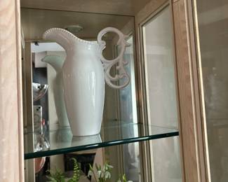 Lovely fleur de lis handle white ceramic pitcher.