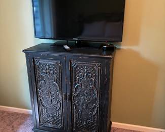 Nice Black 2 door distressed chest. 33.5"X41".  TV is corner to corner 41".  35"W.