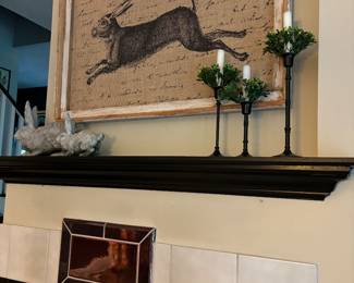 Love our framed Rabbit on Burlap and 2 bunnies keeping watch. Assorted sized (3) Candle Sticks with candles and greenery