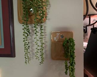 Wall Pottery vases with greenery.