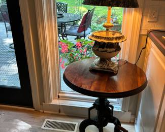 Adjustable crank tripod table.  Another unique metal lamp