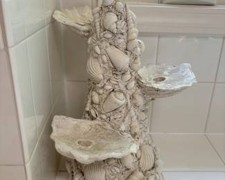 Cluster of shells making up a beautiful candle holder