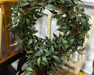 Potted artificial wreath.