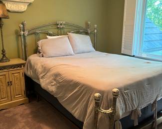Beautiful Queen Size Iron Victorian Bed. Bedding is soft and cozy.