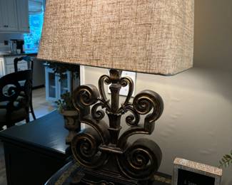 Nice Fleur De Lis Lamp with linen shade. Base is black with burnish gold