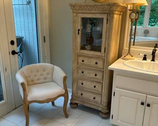 Curio/storage cabinet with glass front door, 4 drawers and bun feet