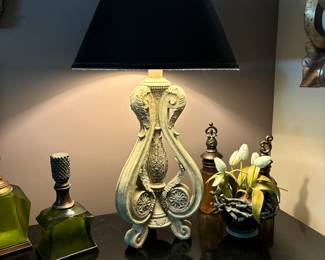 Lovely cream scrolled motif  lamp with black shade. 