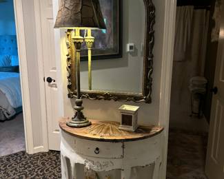 29"X24" Half Moon Table with Natural wood top and Shelf. Distressed white frame and legs with drawer. 40"X25" Beveled Victorian Gold frame mirror. 