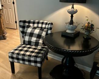Small Buffalo black and white check Wingback Chair.  Wonderful round Black Table with largedbeaded trim and pedestal base.29"Round, 28"T Unique Flower Petal Lamp with black shade. .  29"Sweet bird in nest
