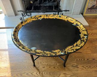 Black gilt decorated tray-style coffee table                      20"h x 31"w x 25.5"d