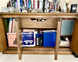 Inside view of vintage buffet (many music books, popular, classical, Christmas, instructional books and music)