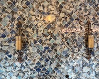 Sconces and super wild tile backdrop.