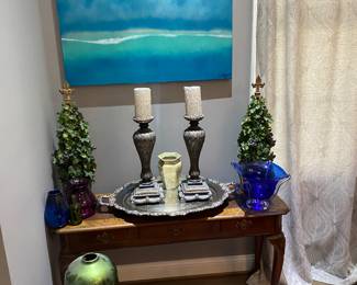 That blue painting has a haunting beauty about it.