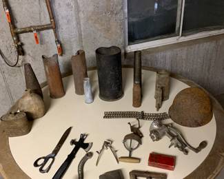Antique shell casings, WW2 helmet and miscellaneous antique items.  