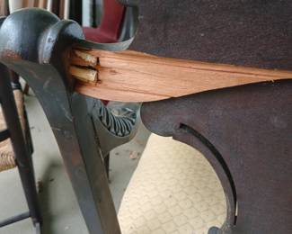 Crack on the back side of the top rail where it engages the left arm.