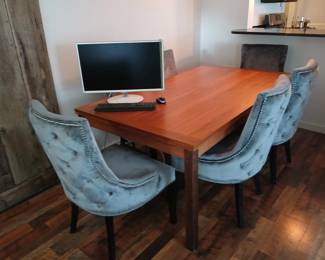 Teak dining table by Scan Interiors.  41x72 with extension leaves each end.  Set includes six matching fabric chairs. $800.
