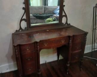 READ CAREFULLY!  This piece is NOT part of the walk-in sale advertised with this listing.  This is a piece I have available at another Midtown Memphis location.  Serious prospective buyers will get a personal viewing any time after the hours of this sale (Fri & Sat after 2:00 and all day Sun.)

Beautiful antique Cherry lady's knee-hole dressing table with mirror.  Needs some love, but no more than any of the rest of us. Dresser is 48x18x32.  Mirror itself is 24x30, total height is 36.  I’m not convinced the two started life together, but this is how my client has used it for the last 25 years.  $120.
