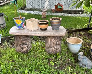 glazed pottery pots , plastic bench