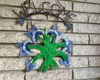 welcome metal sign with flowers