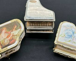 Two Vintage Sankyo Grand Pianos Music Boxes And What Appears To Be A Vintage Silver Plated Sankyo Grand Piano Engraved “Mother’s Day 1999”
Sankyo is not marked for silver plating and cannot be certified, any markings found have been photographed
Please see photos for details and wear
Three music boxes in this collection, two turned on at time of lotting. The sank to music box with the portrait did not, wind appears to be locked up. This full miniature piano collection has currently has been submitted to the Guinness Book of World Records and is pending verification.