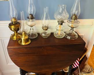 Gate leg drop leaf table and oil lamps 