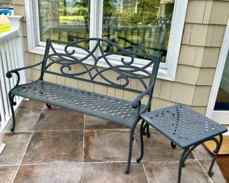 One (of two) cast aluminum benches & side table