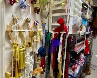 Craft room filled with ribbons, beads, fabric, etc….