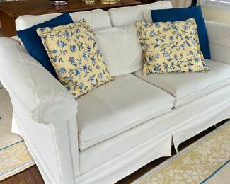 Slip-covered love seat