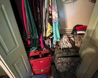 Luggage, hangers, clothes galore!