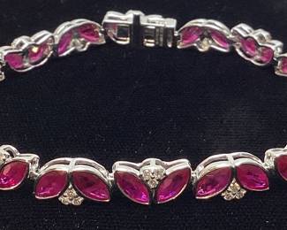 PLATINUM RUBY & DIAMOND BRACELET, 7.5’’ L, RARE G.I.A. CERTIFIED BURMESE RUBIES, 13.35cts RUBIES 0.70cts DIAMONDS, 21.7g TOTAL WEIGHT
AIGL APPRAISAL $37,785.00,

