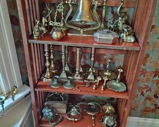 large collection of vintage brass fixtures candle sticks and bells