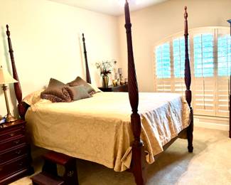 Striking four poster queen bed
