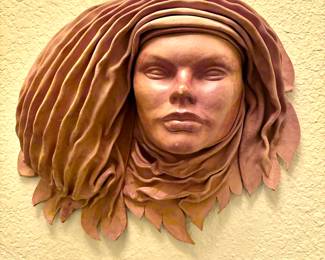 Leather face wall art