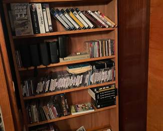Armoire with CDs, DVDs and record albums.