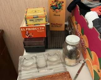 Cigar boxes and ashtrays.