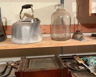 Vintage glass jug bottle with finger handle and vintage tea pot.