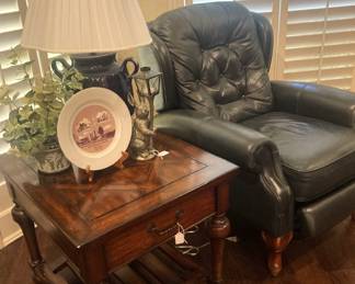 Black leather recliner; side table