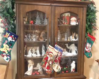 Hutch filled with nativities and other Christmas selections